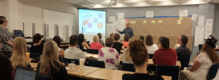 Facilitated session with participants in a consulting workshop.